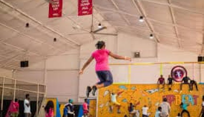woman jumping on a trampoline at Upbeat Recreation Centre