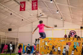 woman jumping on a trampoline at Upbeat Recreation Centre